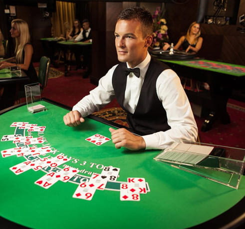 A live dealer at the casino table.